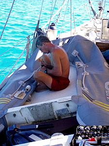 Fixing the dinghy - south side of Moorea.jpg