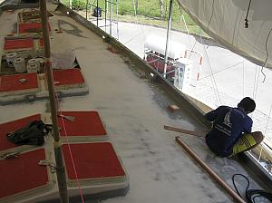 D) Sanding outside rail with longboard.JPG